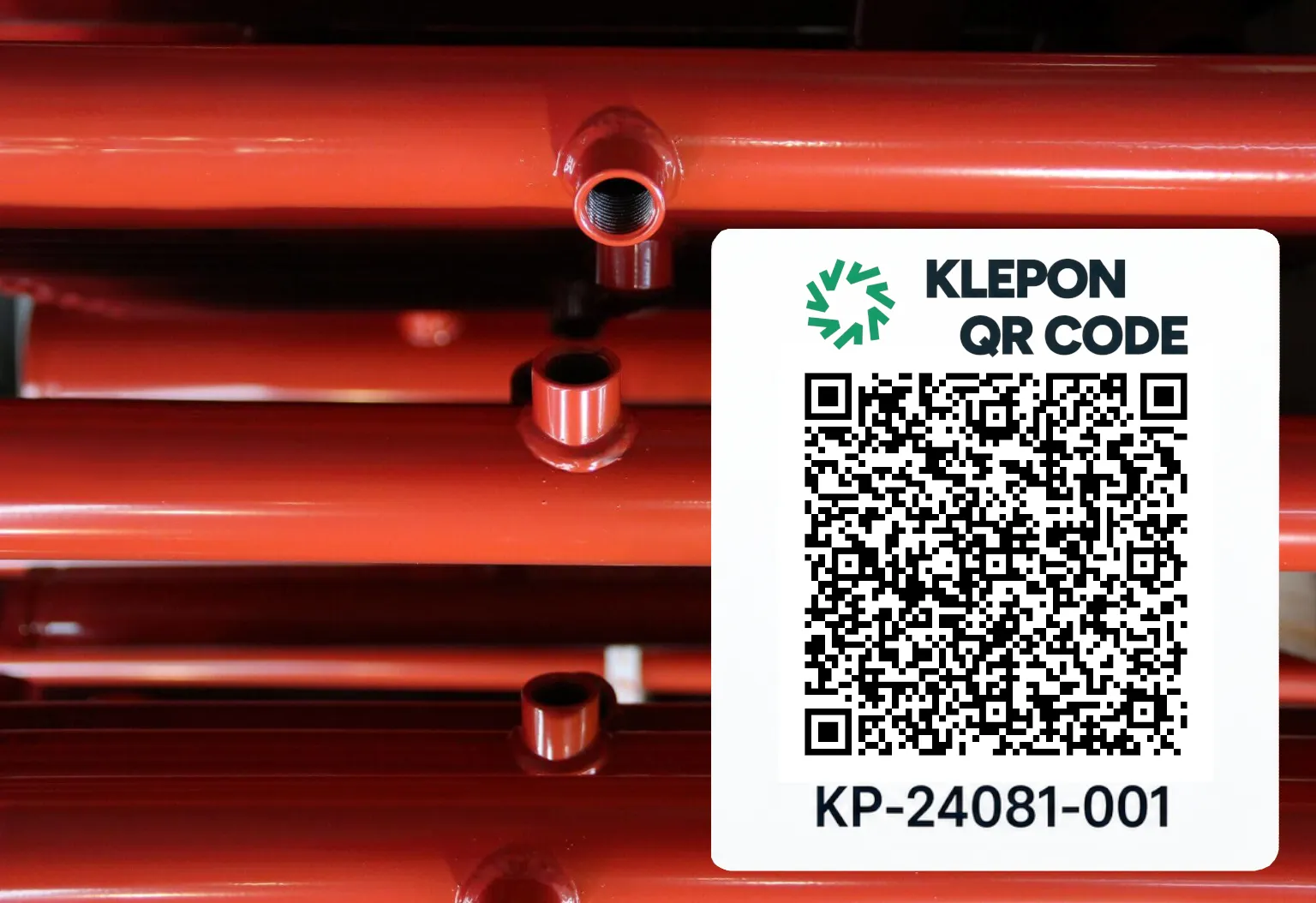 Pallet of red sprinkler pipes labelled with a KLEPON QR code